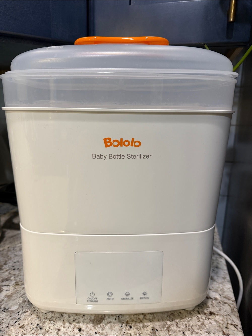 White and Orange Baby Bottle Sterilizer